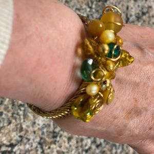 Lovely wrap bracelet. Beautiful stones & easy wrap around bracelet. Gold tone